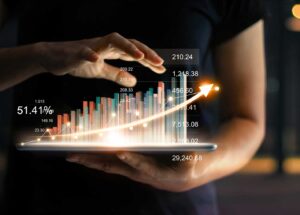 businessman-holding-tablet-showing-growing-virtual-hologram-statistics-graph-chart-with-arrow-up